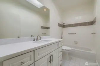 newly updated bathroom with brand new cabinets and countertops.