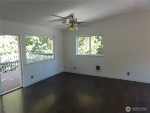 Open concept. Family room off kitchen. Sliding glass door opens to huge deck.