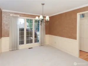 Formal Dining w/ Wainscoting and Wood Clad Casement Windows