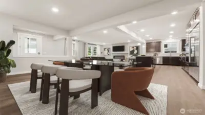 Large great room with large dining area adjoining beautifully appointed kitchen and family area. Actual home is under construction and materials, colors, and finishes will vary. See site agent for details