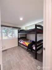 Bedroom with Built in Storage and closet behind the door