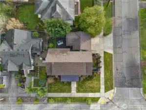 From this vantage point, the generous corner lot comes into full view—easy-care landscaping, a serene backyard retreat wrapped in a privacy hedge, and thoughtful plantings throughout. The home and garage feature 10-year-old roofs, complemented by an upgraded metal roof on the front porch