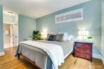 This serene primary suite offers a spacious walk-in closet with direct access to a beautifully appointed ensuite bathroom.