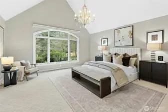 Main-level primary en suite offers luxurious privacy.