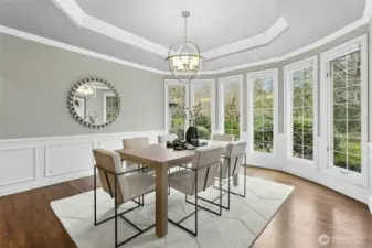 The formal dining space with more picturesque views easily accommodates a statement table.