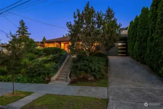 This Mid-Century Modern Gem is a rare opportunity! Perched above the street, offering privacy, and exuding Charm.
