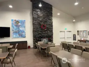 Fireplace and dining area in clubhouse