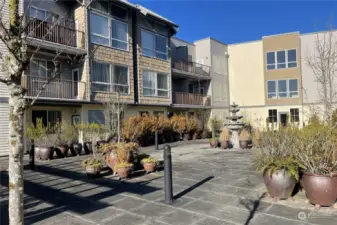 Take in another view of the rooftop courtyard, an ideal spot for entertaining on warm summer evenings. With plenty of space to relax or host friends, this chic outdoor area offers stunning views and the perfect ambiance for unforgettable gatherings.