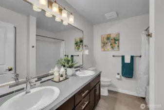Main hall bathroom with two sinks.