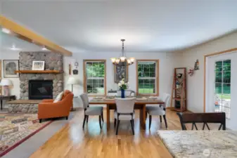 Enjoy a spacious, open-concept layout where the kitchen, dining, and living rooms flow seamlessly together—perfect for hosting friends and family. The cozy fireplace adds warmth and charm, creating an inviting atmosphere for any occasion.