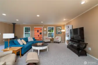 This spacious first-floor bonus room offers flexible use, with great potential to be converted into a downstairs primary suite or a comfortable mother-in-law (MIL) suite, providing added convenience and privacy.