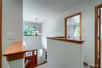 Step through the front door into a bright entryway featuring a staircase that leads gracefully to the second floor, setting the tone for the home’s open and spacious layout.