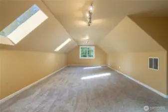 2nd story 50 foot long bonus room with skylights facing the front of the house. Consider the potential for a media room, home gym, guest room, hobby room or play room.