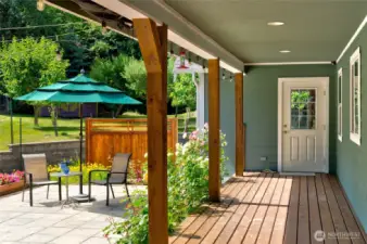 Step through the back door into a large downstairs entertainment room complete with a wet bar, ideal for hosting gatherings or relaxing evenings. This space also offers potential as a separate entrance for a mother-in-law (MIL) suite conversion, providing privacy and flexibility for multigenerational living or guest accommodations.