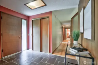 Inside - slate flooring & original paneling and interior window divider greet you with that late-50s vibe.