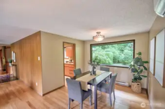 Dining room faces the backyard with its own established landscaping.