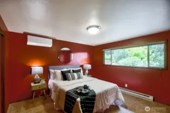 The primary suite, with backyard views out to Watershed Park.