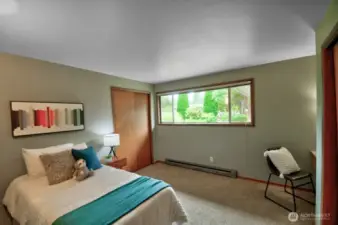 Second bedroom enjoys a front garden view...
