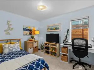 Bedroom #2 - another bright room with space for a bed, storage and a work/study space too!