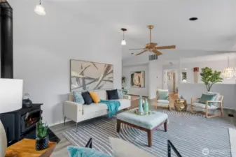 Natural light flows through multiple windows and glass doors.