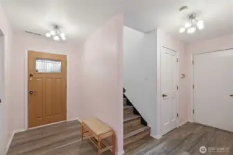 Welcoming entry with updated flooring and second bedroom/ bathroom access.
