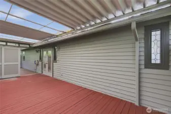 The back deck runs the length of the house with covered areas for Seattle's weather.