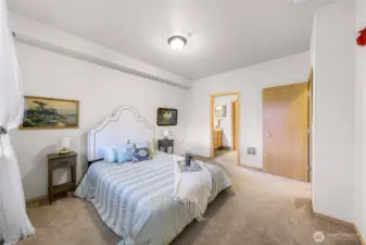 The primary bedroom connects to an en suite bathroom.