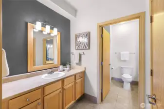 Separate sink for getting ready, along with a walk-in closet on the right.
