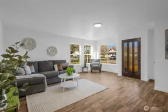 Come on in and relax in this spacious living room with tons of natural light!