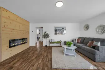 Amazing custom electric fireplace in the living room along with new floors, paint and trim as well!