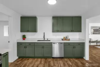 To the left you'll find the laundry room with an entrance to the garage