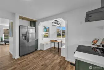 Charming eat-in breakfast nook with custom bench seating! Surrounded by windows for lots of natural light