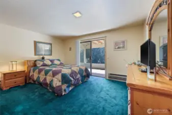 Bedroom with a slider to the covered patio
