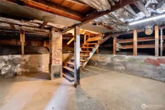 Unfinished basement was used as workshop and extra storage in years past.