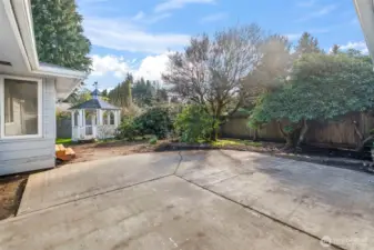 Large patio and ample backyard space for entertaining and gardening.