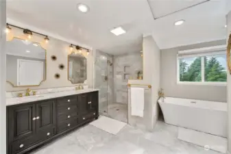 Expansive primary en-suite with walk in shower and marble finishes
