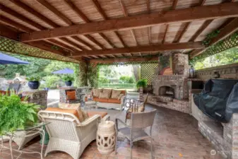 Covered cabana with outdoor fireplace