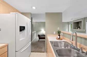 featuring a breakfast bar perfect for casual dining or entertaining guests