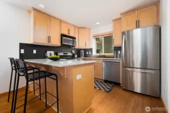 Kitchen peninsula serves as a bar