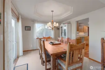 Step from the kitchen into the right-sized formal dining room.  The table pictured is quite large and it fits nicely in this space.