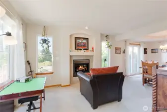 The formal living room is perfectly sized and is centered around a wonderful gas fireplace.