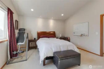 You will appreciate this home's 4 full bedrooms upstairs including this primary suite complete with vaulted ceilings.