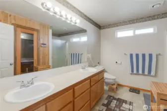 The primary bathroom has dual vanities and plenty of room to share when you get ready for the day.