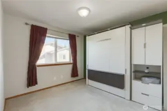 One of the 3 secondary bedrooms in this home.  The Murphy Bed pictured is included in the sale!