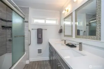 The guest bath has been updated with new lighting, cabinetry, mirrors, and Quartz counters. It also includes a large walk-in shower and a bathtub. We hope your guests enjoy it!
