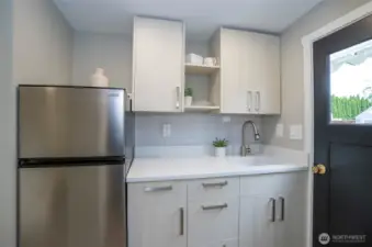 Versatile detached studio is perfect for guests, a home office, or business use .