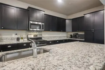 Basin sink makes it easy to clean up larger items, built-in microwave means more counter space.