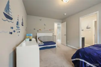 2nd bedroom with bathroom in view.