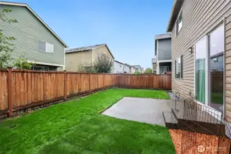 Lush grass surrounds the patio-- a perfect yard for easy enjoyment.