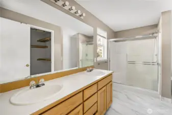 Primary en suite - private bathroom with dual sinks, shower and walk-in shower.